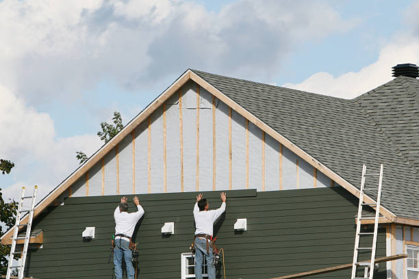 Professional Storm Damage Siding Repair technician working in Davidson, NC